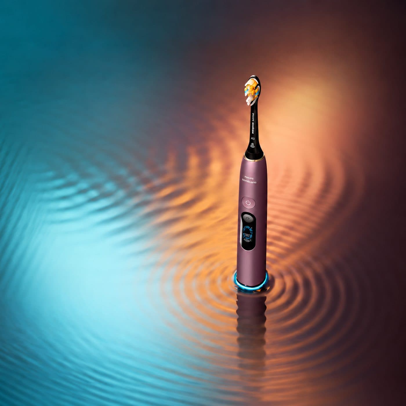 Фиолетовая Philips Sonicare DiamondClean 9900 Prestige на цветном фоне