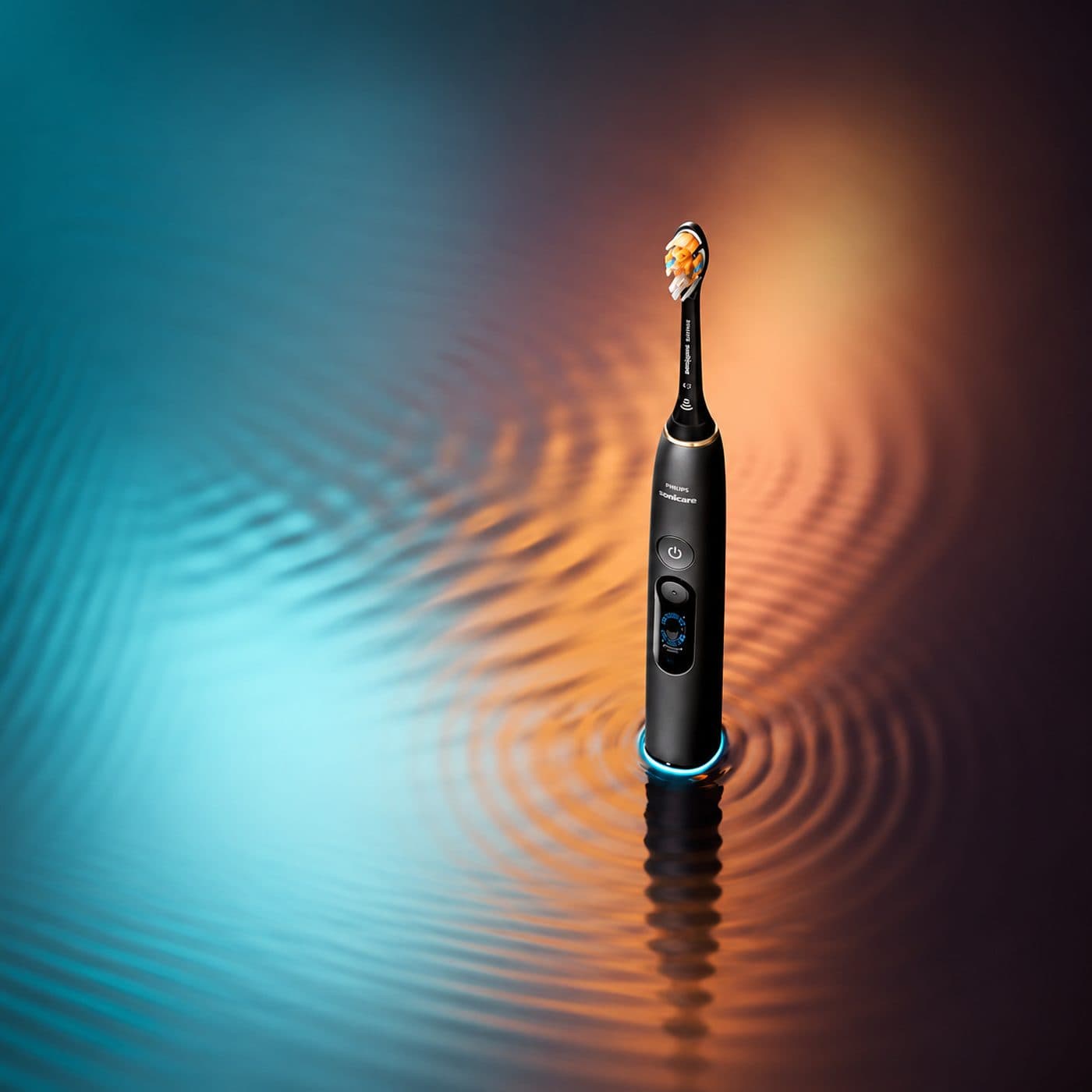 Чёрная Philips Sonicare DiamondClean 9900 Prestige на цветном фоне